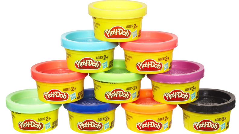 A stack of small jars of Play-Doh in a selection of different colors.