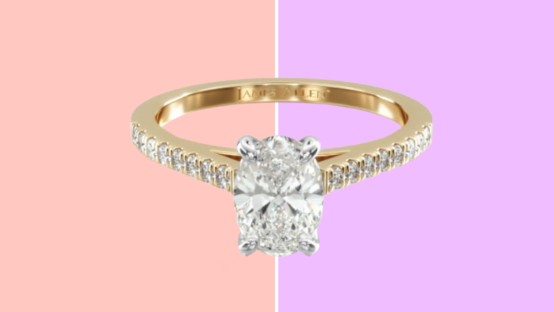 A diamond ring in gold with paved diamond accents on the band.