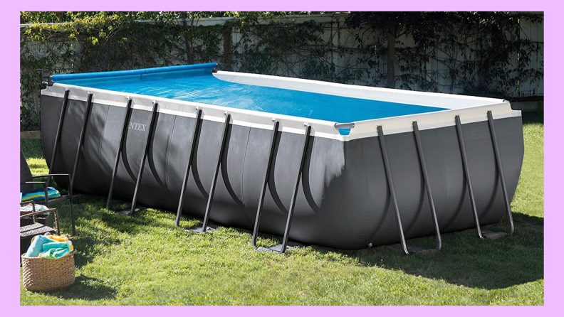 An Intex pool cover sits on an above-ground pool.
