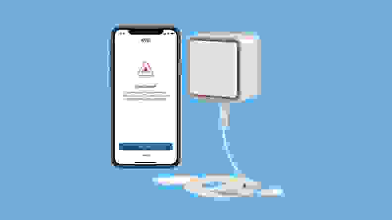 The Eve Water Guard next to an iPhone displaying water leak alerts