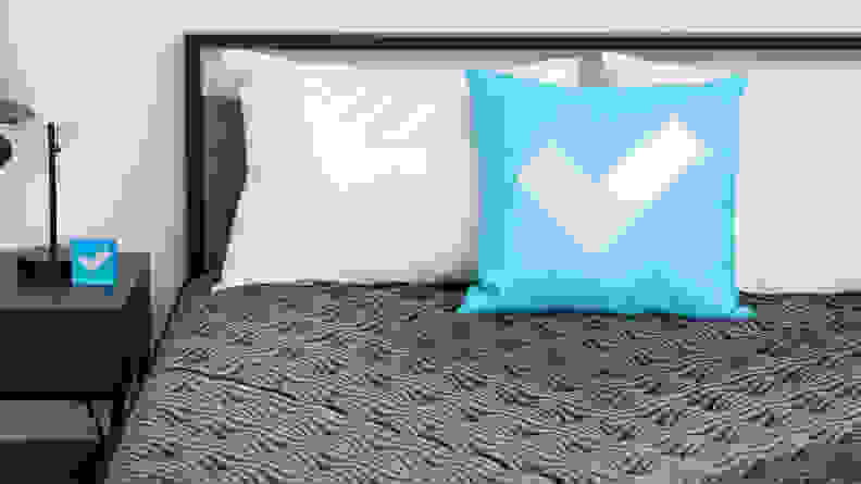 The mattress with the Reviewed logo pillow.