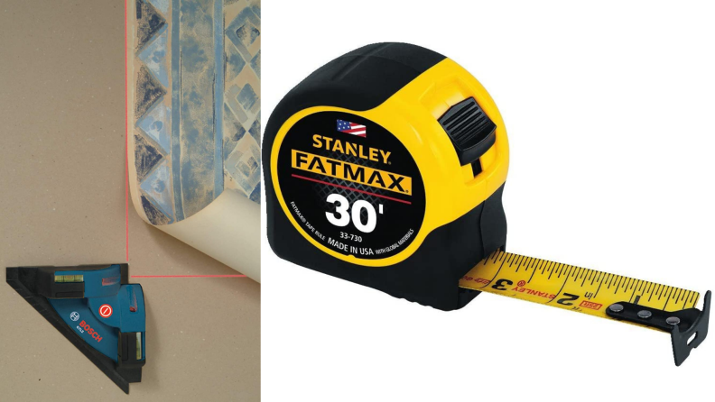 On left, square laser level being used to apply wallpaper to wall. On left, yellow and black tape measure.