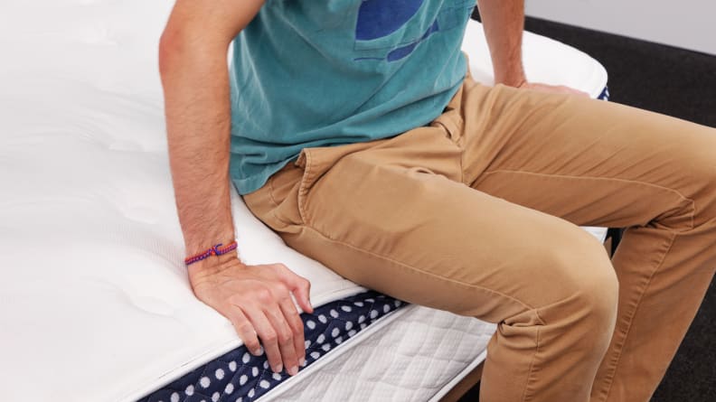 Man sitting on mattress
