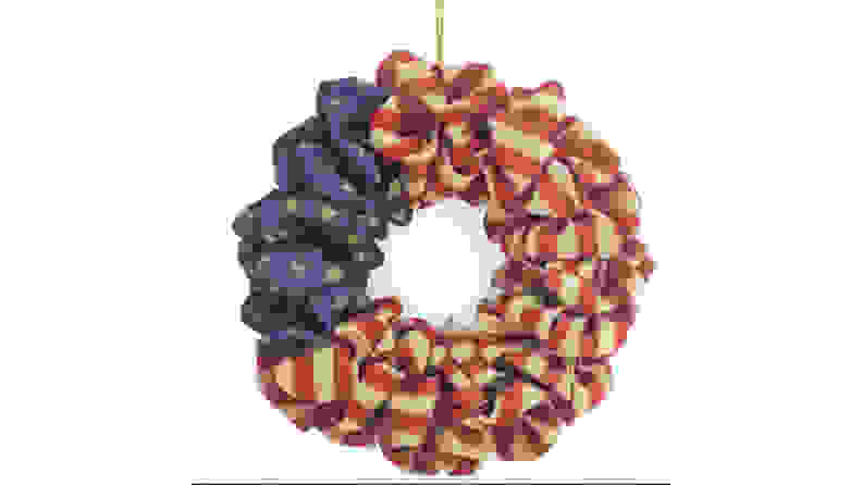 Wreath with American flag image on it.