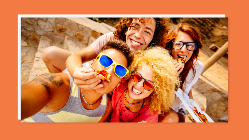 A group of teens taking a picture hanging out at a tiled place.