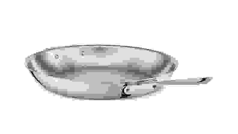 A copper All-Clad stir-fry pan is displayed against a white backdrop.