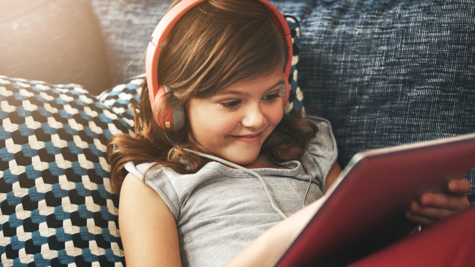 Child playing video games on an iPad