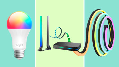 A smart bulb, smart lightning hub, and smart rope light are shown on a Reviewed background.