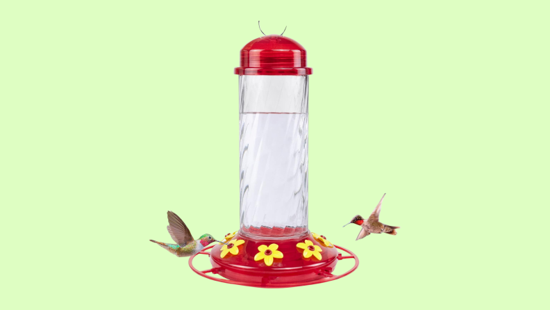 Two hummingbirds feed from the BOLITE Hummingbird Feeder with a red cap and base.