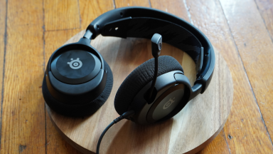 A pair of SteelSeries Arctis Nova 1 headphones with the microphone jetting out.