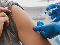 medical professional administering vaccine