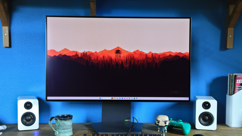 An LG Ultragear 32GS95UE-B gaming monitor showing a Firewatch background