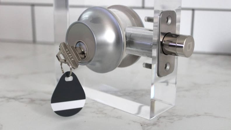 The Level Lock+ Connect smart deadbolt with a key in the exterior face.