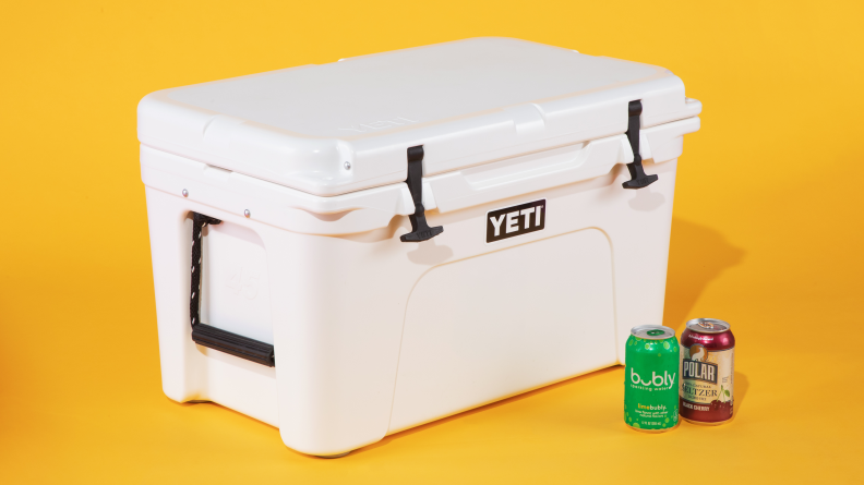 A white Yeti cooler against a yellow background.