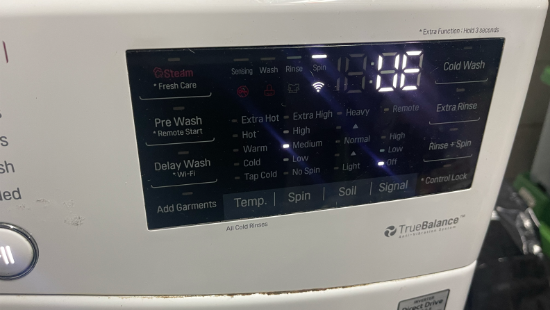A close-up view of a washing machine control settings.