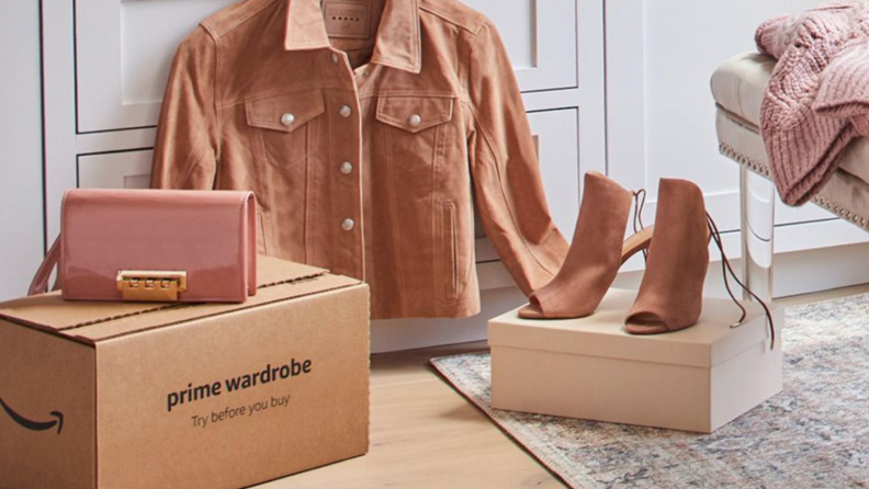 An image of a Prime box alongside a clutch, high heels, and a jacket in the same shade of dusty rose.