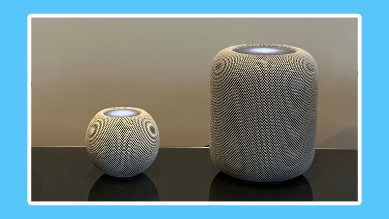 Apple HomePod Mini and HomePod together in a black face.