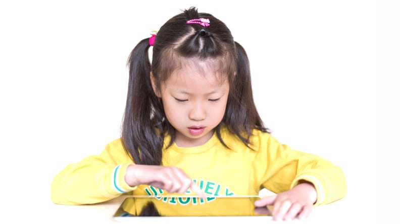 Young girl learning in a tablet