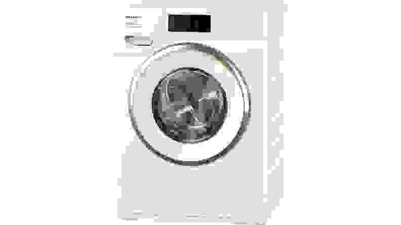 The Miele W1 washer sits in a very modern home, next to its paired dryer.