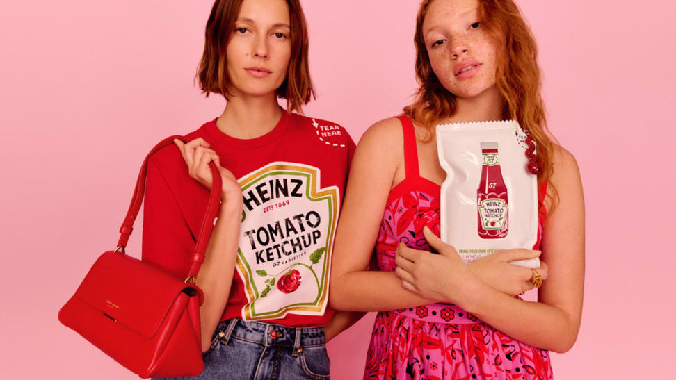 Two models wearing clothing and accessories from the Kate Spade New York x Heinz collaboration.