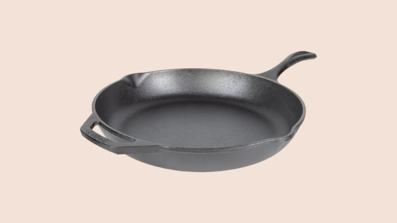 Cast iron skillet against beige background