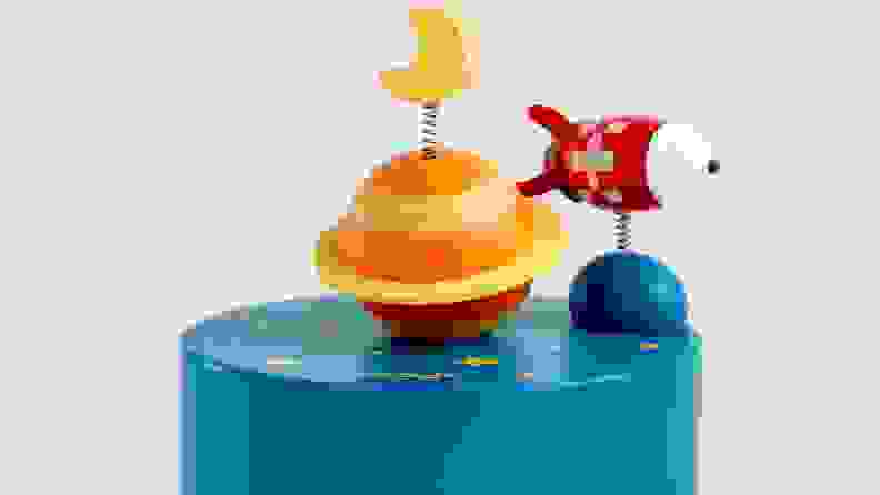 Wooden toy that is a planet and a spaceship