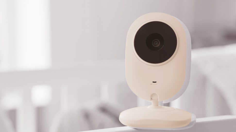 Enchanced image of a baby monitor on a crib.