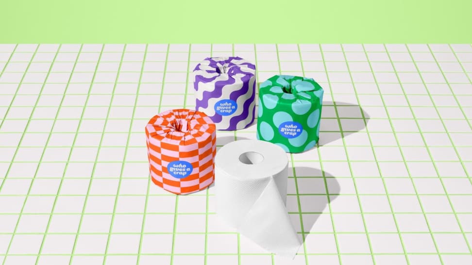 colorful toilet paper rolls on tile floor