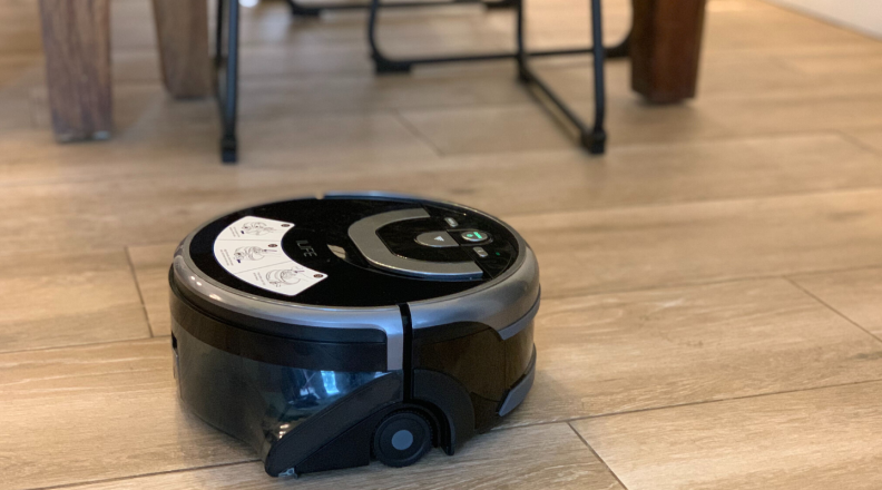 The iLife Shinebot W400 robot mop cleans a tile floor.