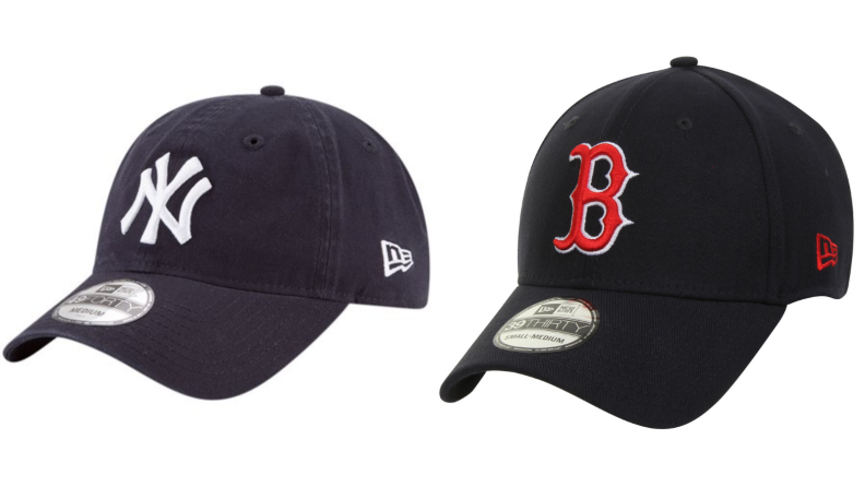 Yankees cap next to a superior Red Sox hat