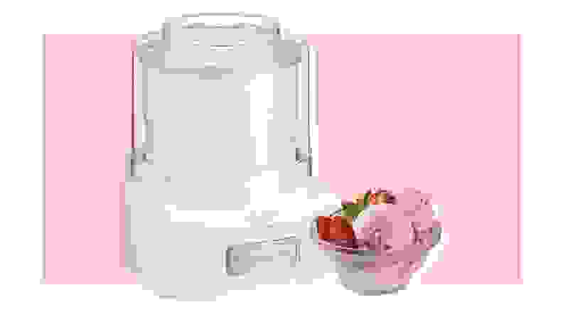 Cuisinart Ice Cream Maker and bowl of strawberry ice cream on pink background