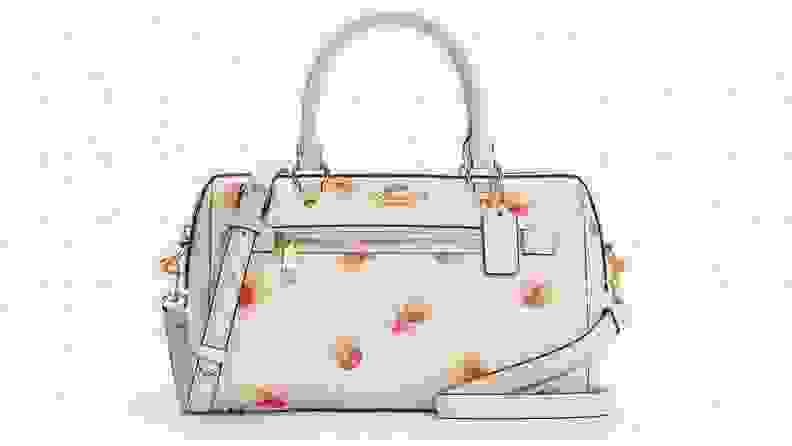 Cream and floral leather Coach purse.
