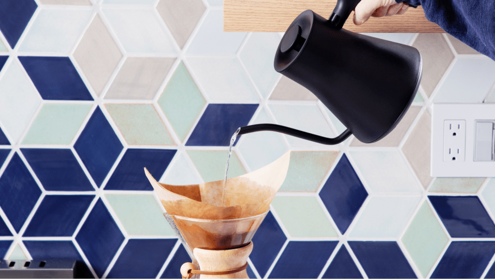 The Fellow Stagg EKG Pro pouring water onto a pour-over filter with coffee grounds
