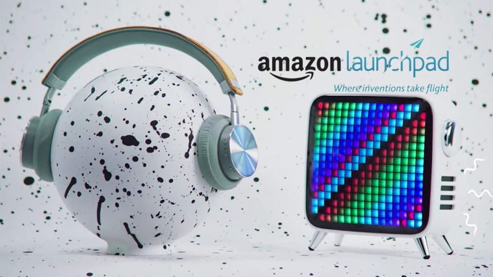 grey background with tablet and headphones on speckled ball that reads "Amazon launchpad"