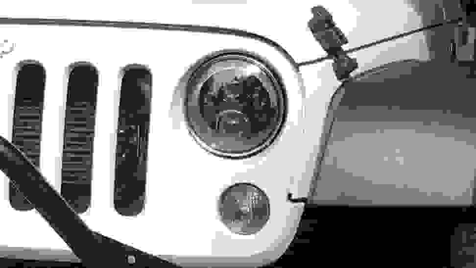 An LED headlight on a Jeep Wrangler.