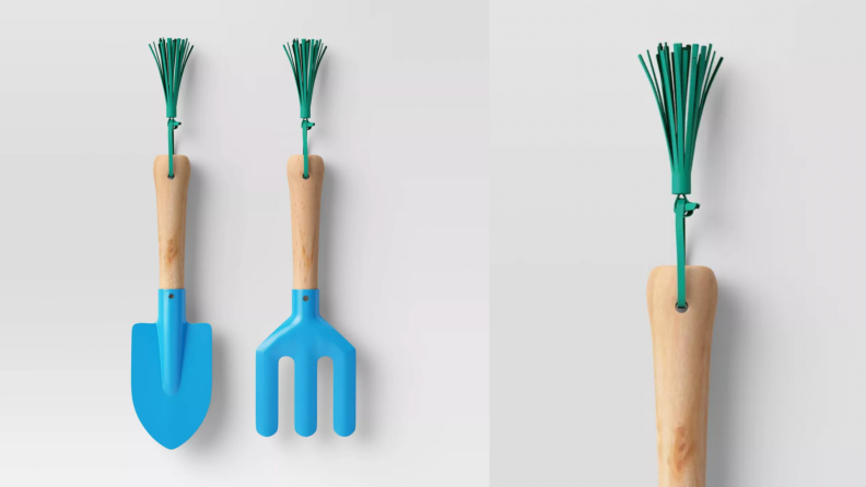 A children's gardening tool set with a shovel and cultivator.