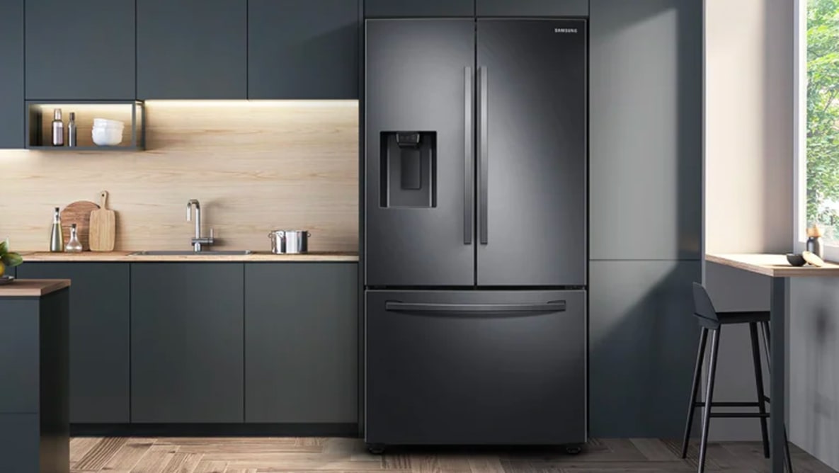 An image of the front of the Samsung RF27T5201SG French door refrigerator in a modern kitchen.