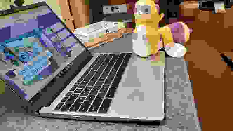 The Framework Chrome on a desktop with a stuffed animal next to it.