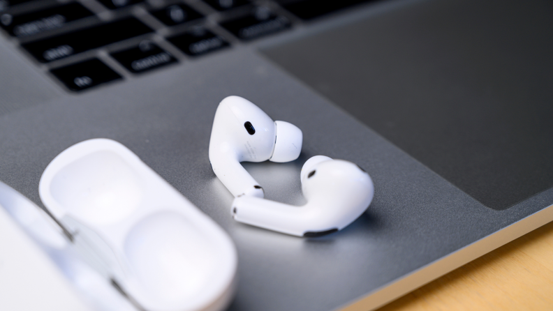 Close up of Apple Air Pods on a laptop.