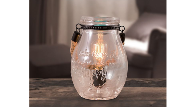 A glass jar-shaped wax melter