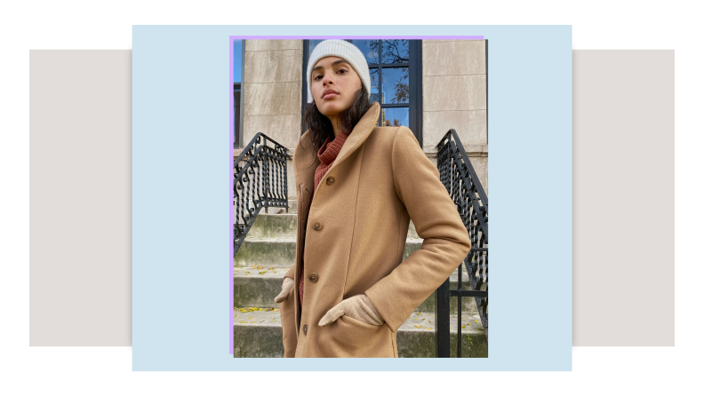 Model wearing tan longline wool coat.