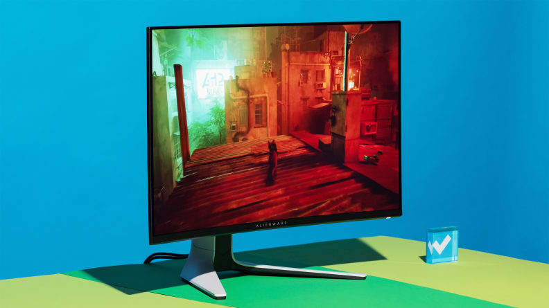 a 32 inch OLED gaming monitor on a bright blue background