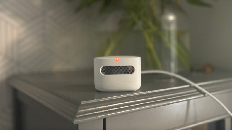 Amazon Smart Air Quality Monitor indoors sitting on top of table.