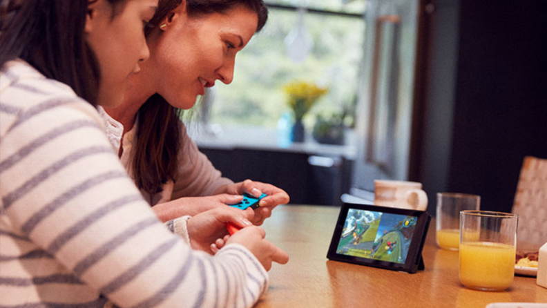 Mom and daughter playing a Nintendo Switch