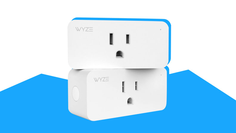 Two white Wyze plugs sit on top of one another against a blue and white background.