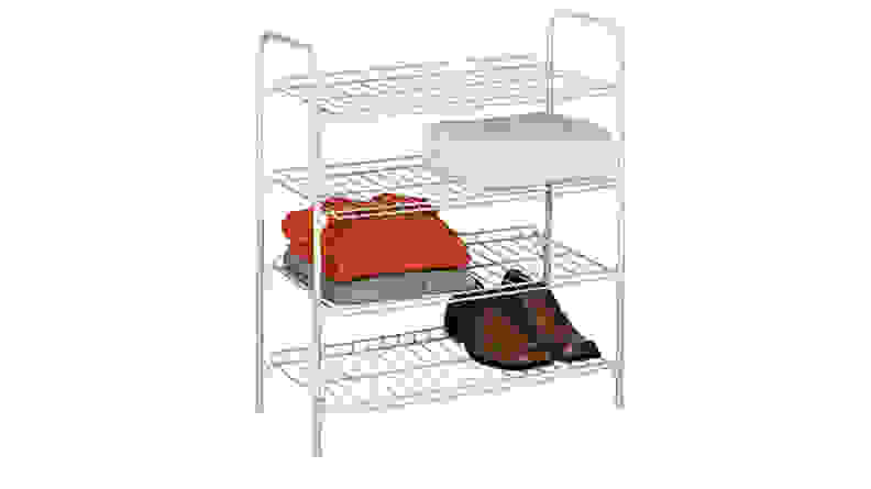 A shelf with shirts and shoes on it.