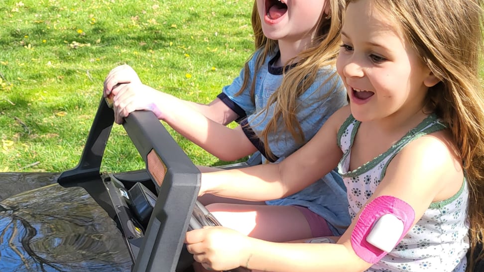 Closeup of children driving the buggy