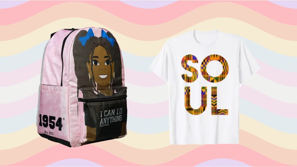 A pink backpack with a young Black girl on the front and the words "I can do anything", next to a tee-shirt with the word "SOUL" printed on the front on a rainbow background.