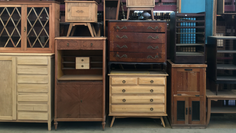 Several wooden dressers stacked on top of each other