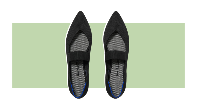 A pointed flat shoe with a wide Mary Jane strap.